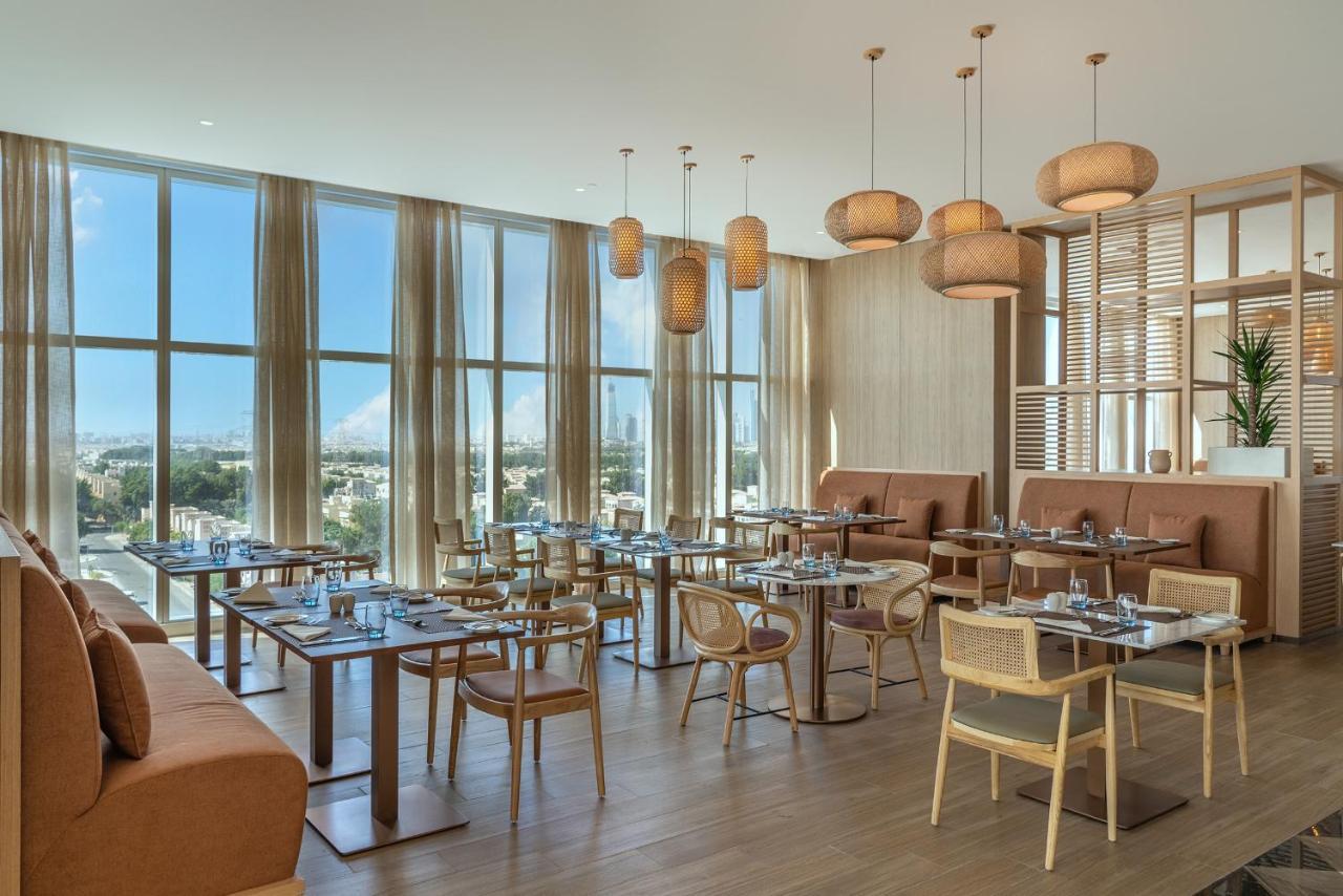 Novotel Jumeirah Village Triangle Dubai Exterior photo